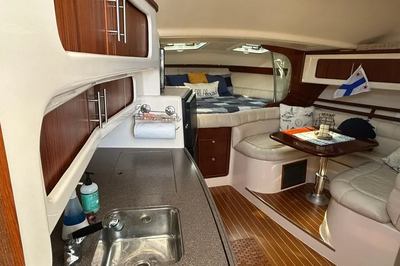 Slide: The Image of Luxurious 2007 Grady-White Express 360 cabin interior with kitchenette and cozy seating area. - 26