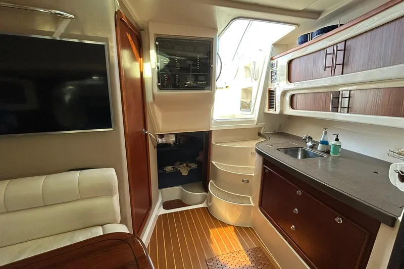 Slide: The Image of Interior of 2007 Grady-White Express 360 boat with kitchenette and seating area. - 33