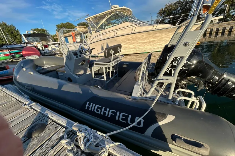 Slide: The Image of Highfield inflatable boat docked beside a 2007 Grady-White Express 360 yacht. - 34