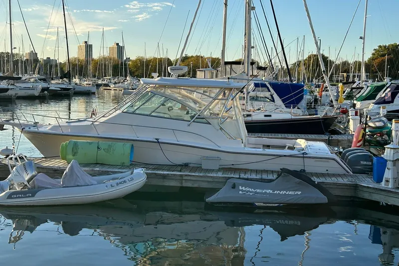 Slide: The Image of 2007 Grady-White Express 360 boat docked in a marina with other vessels. - 36