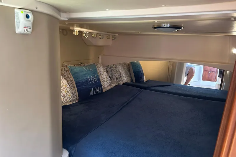 Slide: The Image of Interior cabin of 2007 Grady-White Express 360 with cozy bedding and pillows. - 4