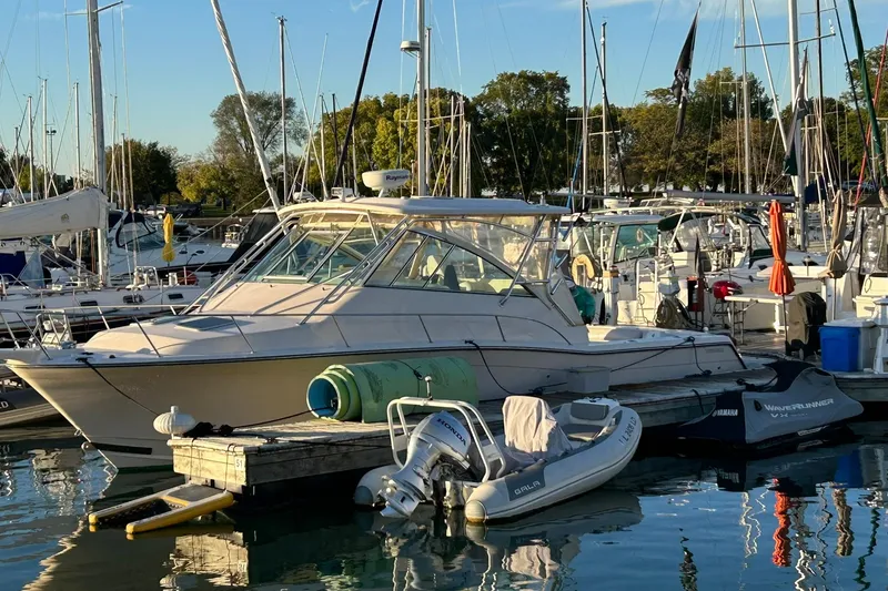Slide: The Image of 2007 Grady-White Express 360 boat docked at marina with surrounding vessels. - 41