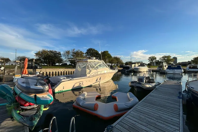 Slide: The Image of 2007 Grady-White Express 360 docked at a marina under a clear blue sky. - 44