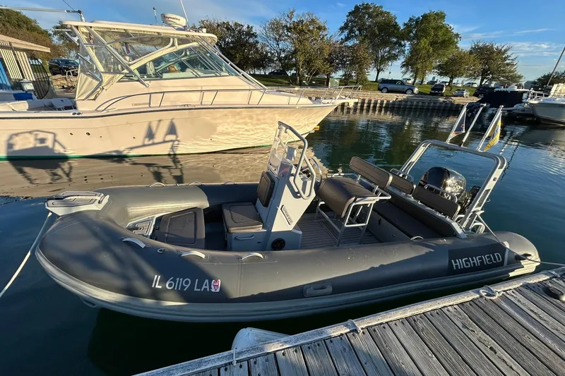 Slide: The Image of 2007 Grady-White Express 360 docked beside a Highfield inflatable boat. - 46