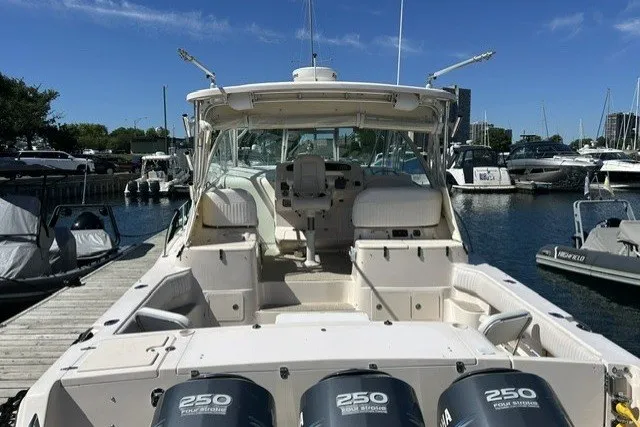 Slide: The Image of 2007 Grady-White Express 360 boat docked, featuring triple 250 horsepower engines. - 67