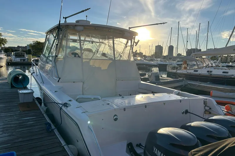 Slide: The Image of 2007 Grady-White Express 360 boat docked at marina during sunset. - 50