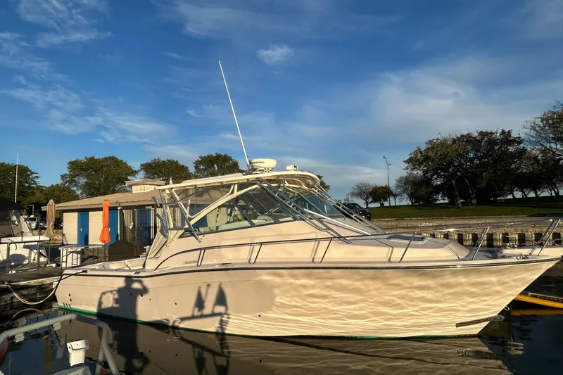 Slide: The Image of 2007 Grady-White Express 360 boat docked under a clear blue sky. - 52