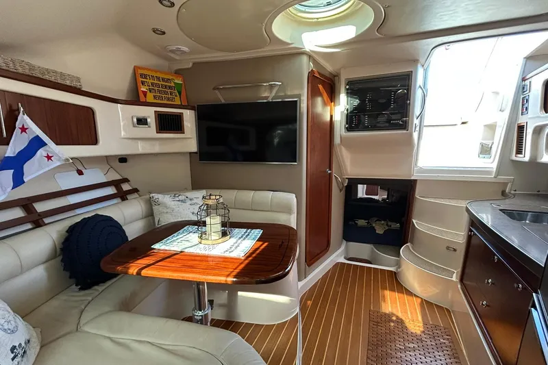 Slide: The Image of Luxurious interior of a 2007 Grady-White Express 360 boat with seating, table, and modern amenities. - 54