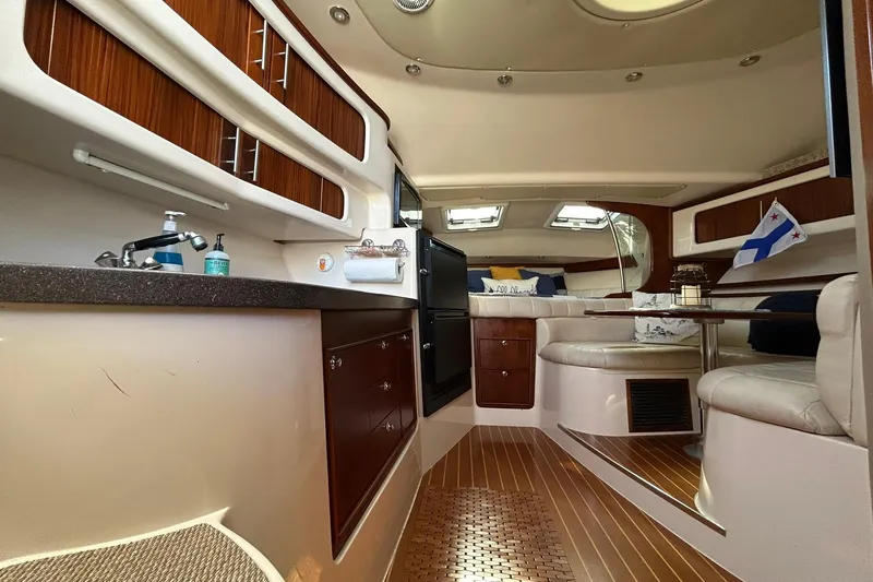 Slide: The Image of Luxurious interior of a 2007 Grady-White Express 360 boat with elegant wood finishes. - 56