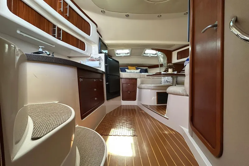 Slide: The Image of Luxurious interior of 2007 Grady-White Express 360 boat with wood accents and seating area. - 57