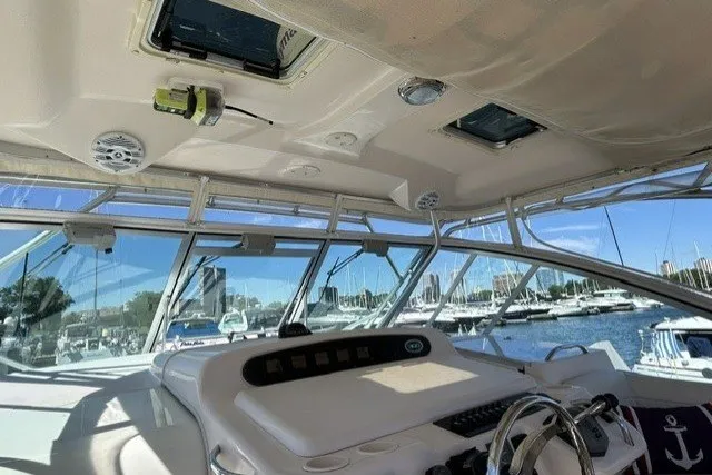 Slide: The Image of 2007 Grady-White Express 360 boat interior with helm, marina view, and clear skies. - 74