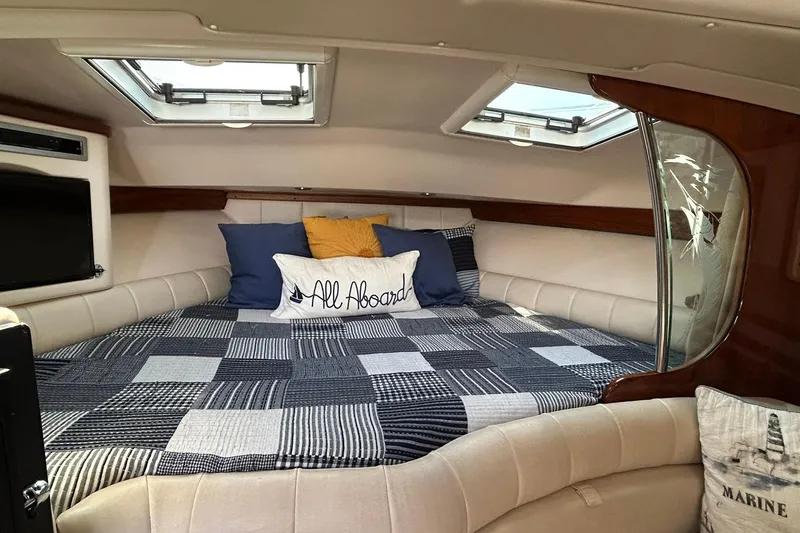 Slide: The Image of Cozy cabin interior of 2007 Grady-White Express 360 with nautical decor and skylights. - 59