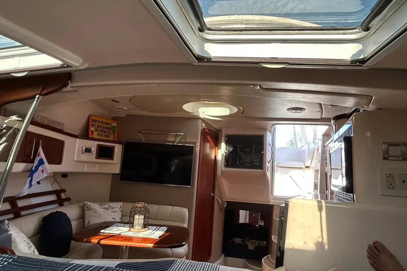 Slide: The Image of Interior of 2007 Grady-White Express 360 boat with skylight and cozy seating area. - 60