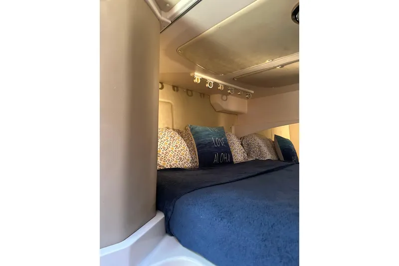 Slide: The Image of Cozy cabin interior of 2007 Grady-White Express 360 with plush bedding. - 7
