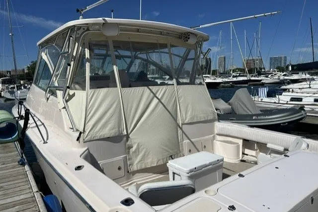 Slide: The Image of 2007 Grady-White Express 360 boat docked at marina under clear blue sky. - 70