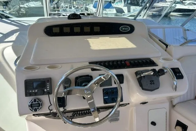 Slide: The Image of 2007 Grady-White Express 360 helm with steering wheel and control panel. - 64