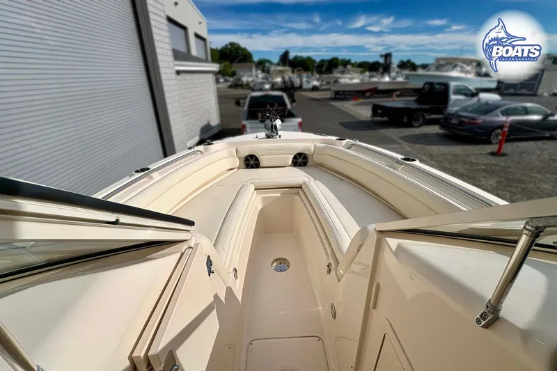 Slide: The Image of 2019 Grady-White Freedom 235 boat interior, showcasing spacious seating and sleek design. - 5