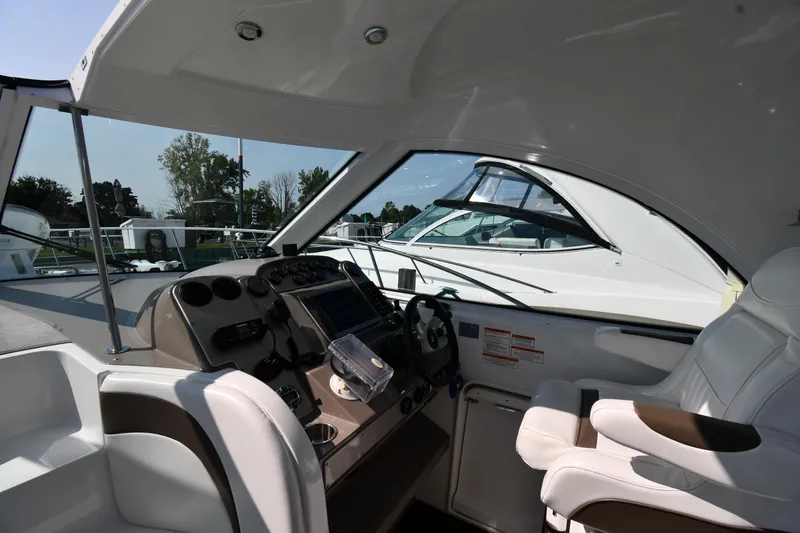 Slide: The Image of 2010 Cruisers Yachts 390 Sports Coupe cockpit with modern controls and seating. - 12