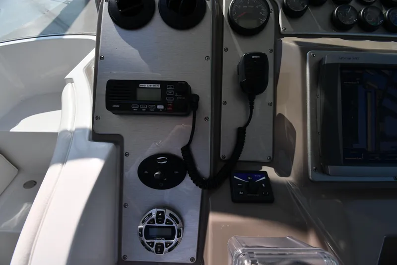 Slide: The Image of 2010 Cruisers Yachts 390 Sports Coupe dashboard with radio and controls. - 15