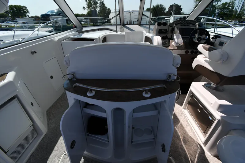 Slide: The Image of 2010 Cruisers Yachts 390 Sports Coupe interior with helm and seating area. - 26