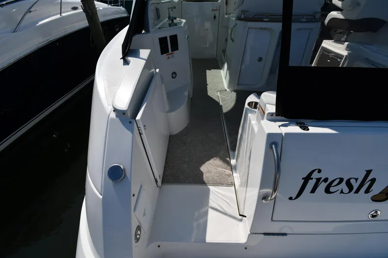 Slide: The Image of 2010 Cruisers Yachts 390 Sports Coupe, rear deck view with open door. - 29