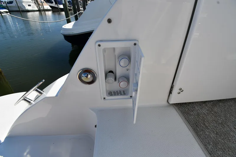 Slide: The Image of 2010 Cruisers Yachts 390 Sports Coupe, deck control panel near marina. - 30