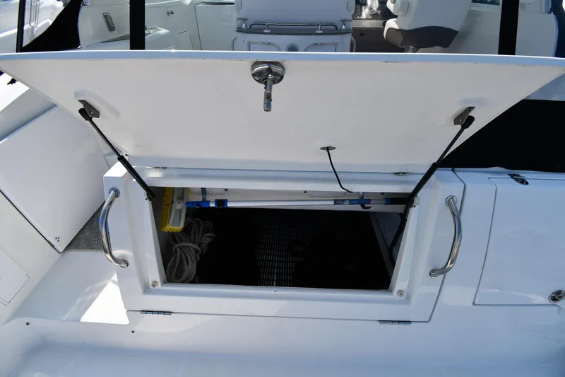 Slide: The Image of 2010 Cruisers Yachts 390 Sports Coupe storage compartment open on deck. - 31