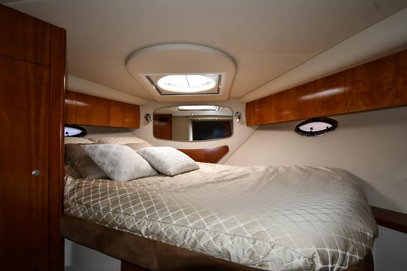 Slide: The Image of Luxurious cabin interior of 2010 Cruisers Yachts 390 Sports Coupe with cozy bedding. - 37