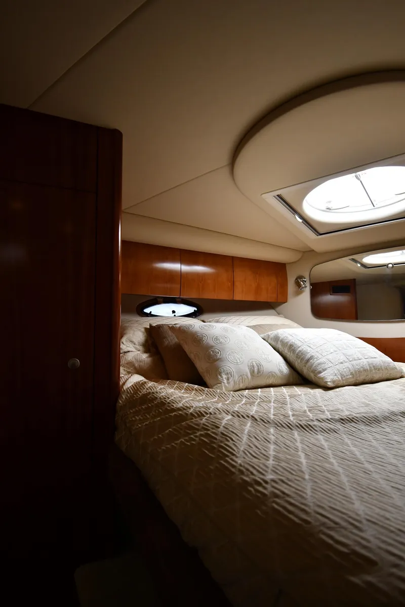 Slide: The Image of Luxurious cabin interior of 2010 Cruisers Yachts 390 Sports Coupe with plush bedding. - 39