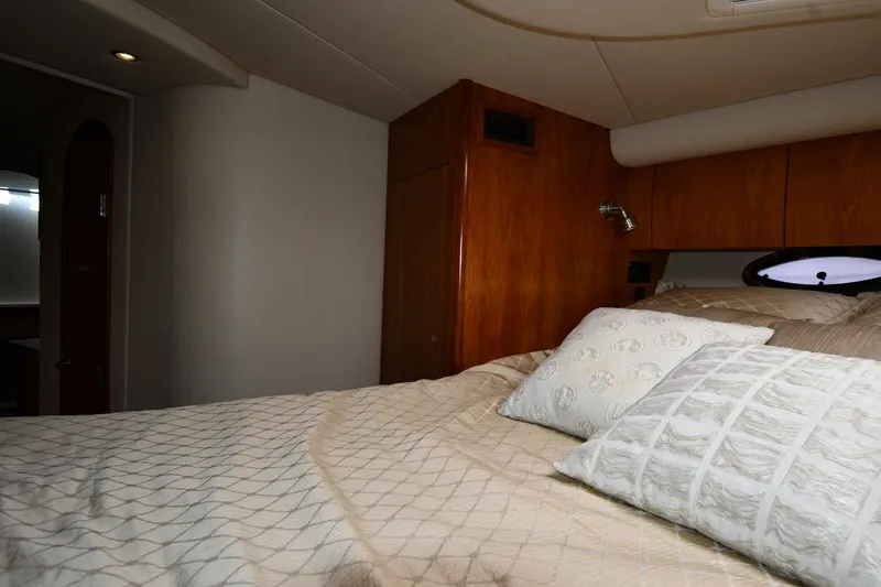 Slide: The Image of Interior cabin of 2010 Cruisers Yachts 390 Sports Coupe with cozy bedding. - 40
