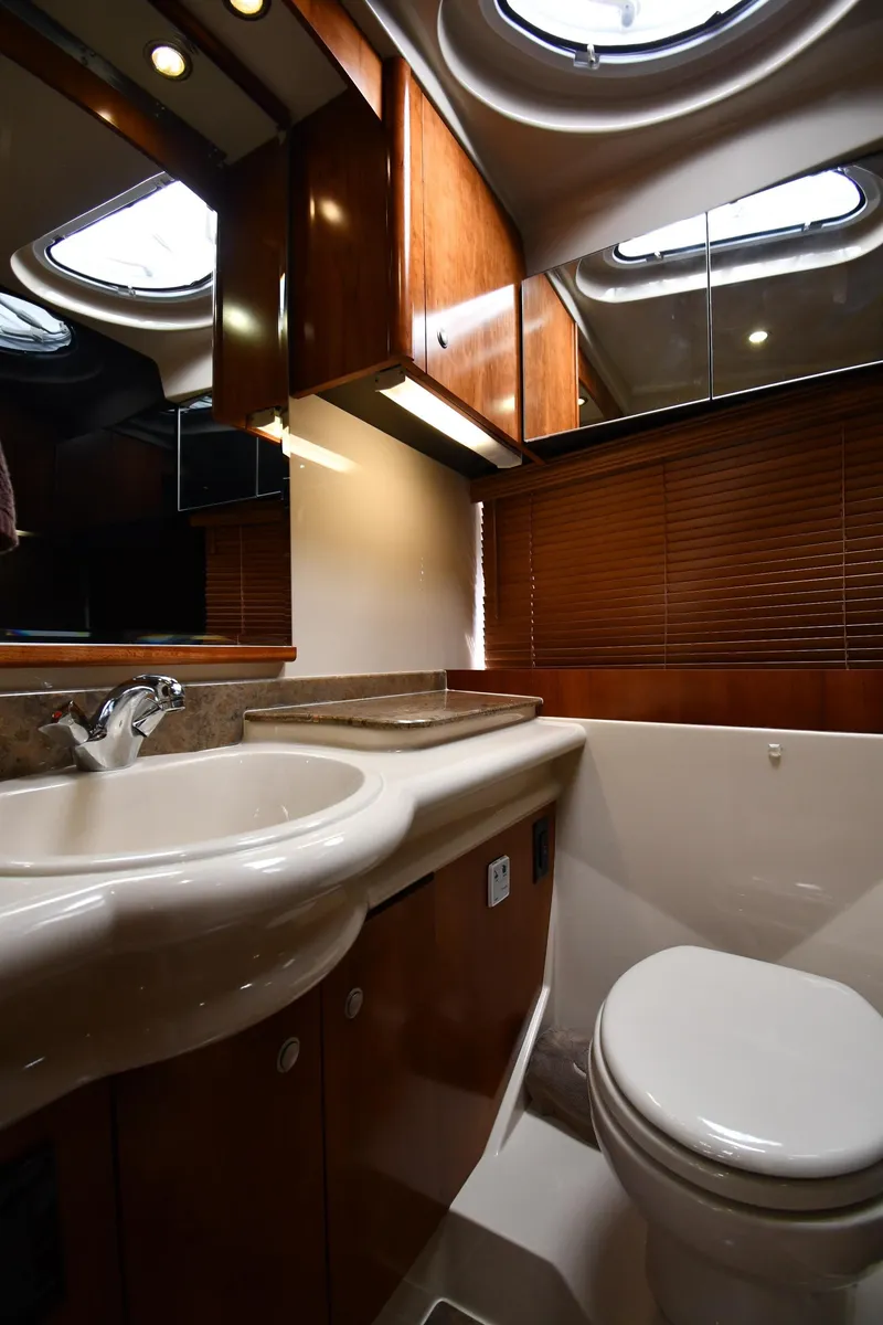 Slide: The Image of Luxurious bathroom in 2010 Cruisers Yachts 390 Sports Coupe with modern fixtures and wood accents. - 43