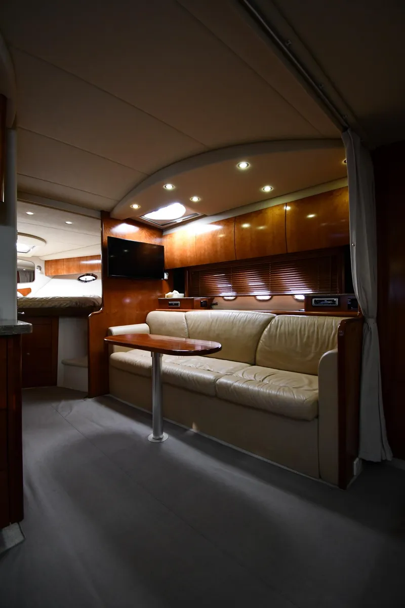 Slide: The Image of Interior of 2010 Cruisers Yachts 390 Sports Coupe, featuring elegant seating and modern lighting. - 46