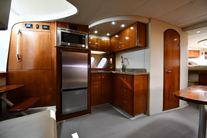 Slide: The Image of Interior of 2010 Cruisers Yachts 390 Sports Coupe with modern kitchen amenities. - 47