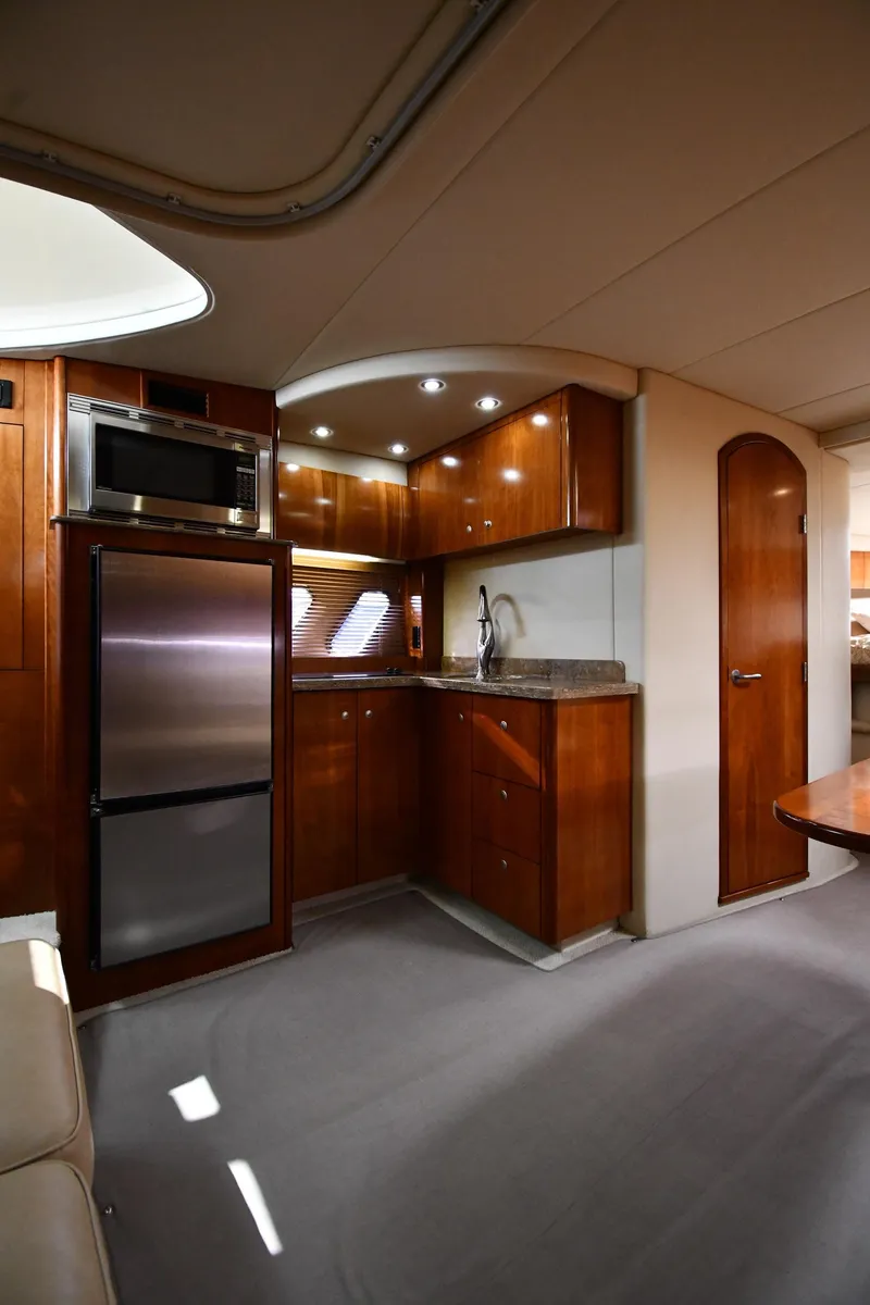 Slide: The Image of Interior of 2010 Cruisers Yachts 390 Sports Coupe with modern kitchen amenities. - 48