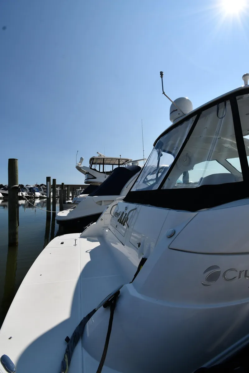 Slide: The Image of 2010 Cruisers Yachts 390 Sports Coupe docked under clear blue sky. - 8