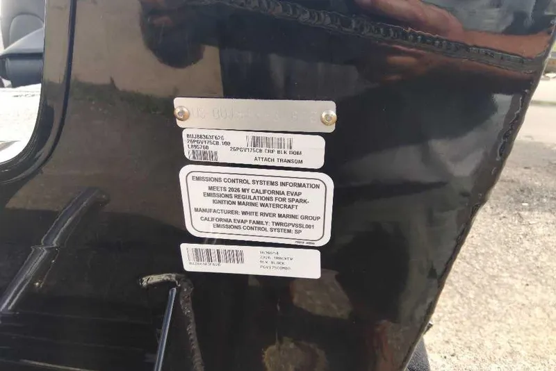 Slide: The Image of 2026 Tracker Pro Guide V-175 Combo emissions control label on black surface. - 9