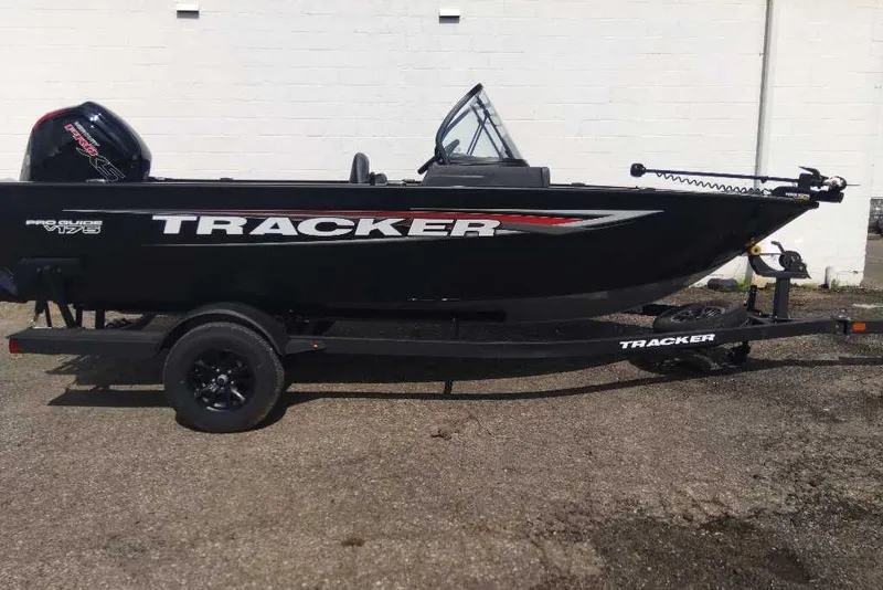 Slide: The Image of 2026 Tracker Pro Guide V-175 Combo boat on trailer, black exterior, side view. - 3