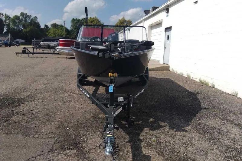 Slide: The Image of 2026 Tracker Pro Guide V-175 Combo boat on trailer in outdoor lot. - 6
