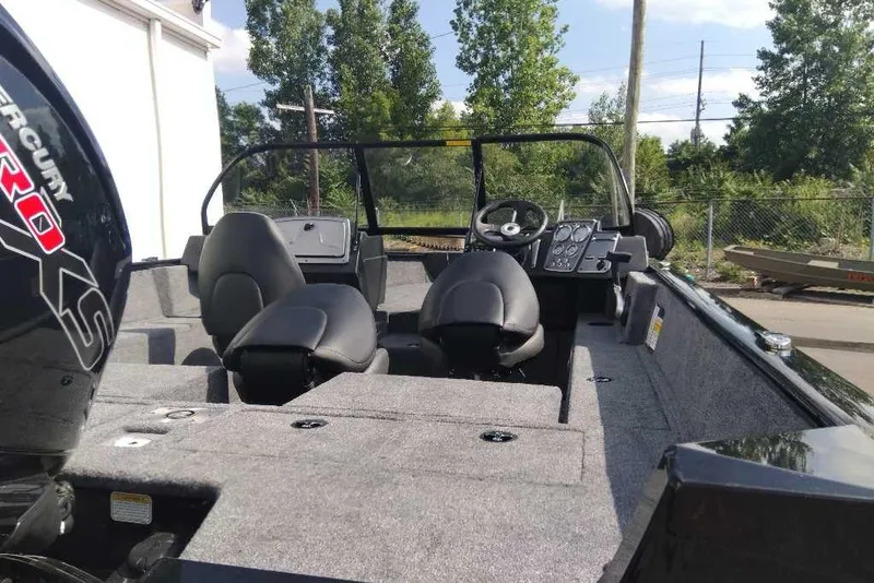 Slide: The Image of 2026 Tracker Pro Guide V-175 Combo boat interior with steering console and seating. - 8