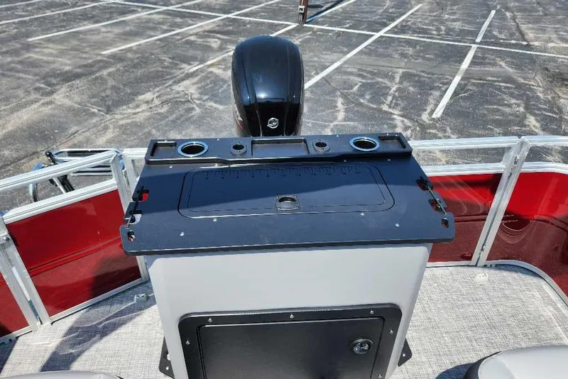 Slide: The Image of 2026 Sun Tracker SportFish 20 DLX boat deck with fishing station and motor. - 7