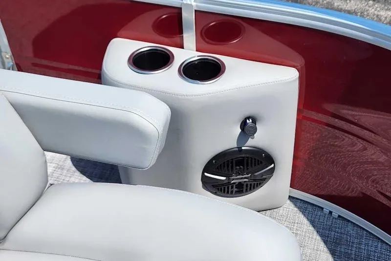 Slide: The Image of 2026 Sun Tracker SportFish 20 DLX boat interior with cup holders and speaker. - 9