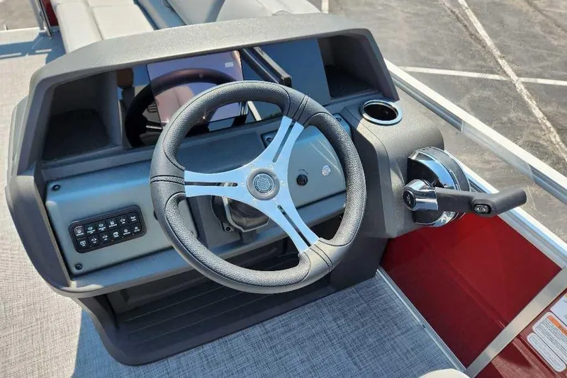 Slide: The Image of Steering console of 2026 Sun Tracker SportFish 20 DLX pontoon boat, featuring modern controls. - 4