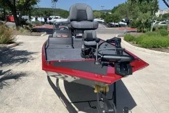 Slide: The Image of 2026 Tracker Bass Tracker Classic XL boat in a parking lot, featuring a sleek red design. - 3
