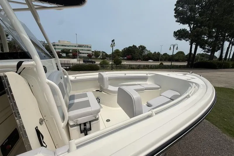 Slide: The Image of 2026 Mako 214 Center Console boat with spacious seating and sleek design. - 17