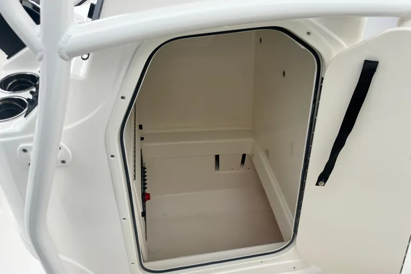 Slide: The Image of Open storage compartment on 2026 Mako 214 Center Console boat. - 5