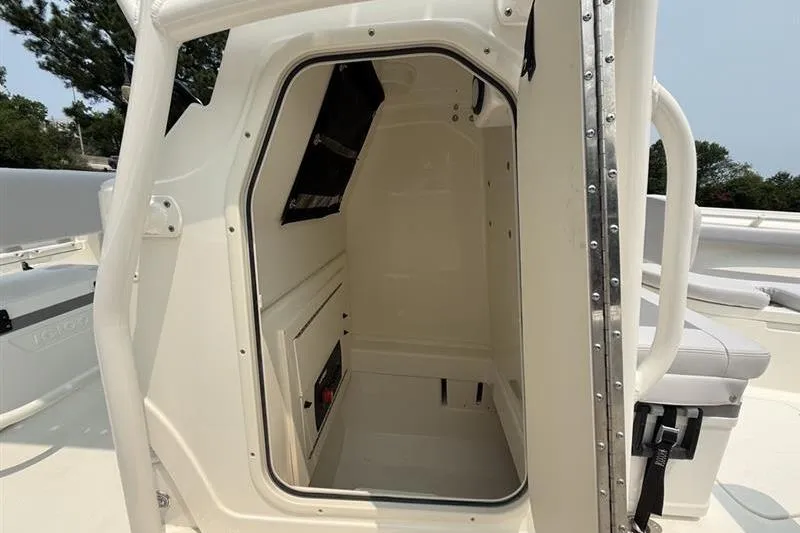 Slide: The Image of 2026 Mako 214 Center Console boat interior cabin view. - 21