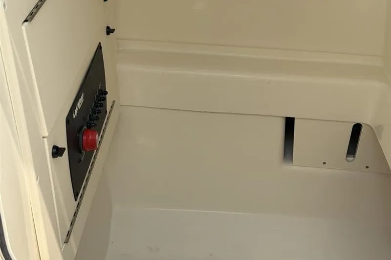 Slide: The Image of Interior view of 2026 Mako 214 Center Console boat compartment. - 20