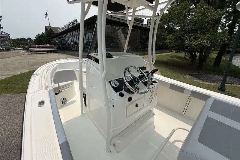 Slide: The Image of 2026 Mako 214 Center Console boat with sleek design and modern controls. - 14