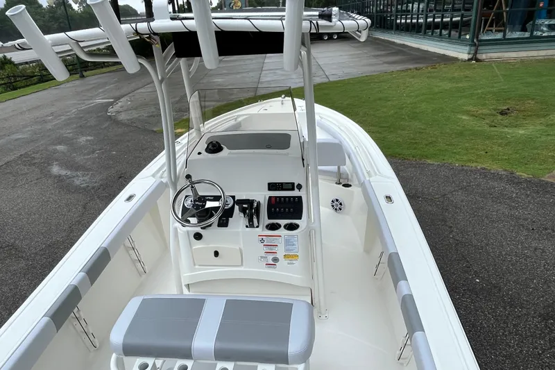 Slide: The Image of 2026 Mako 214 Center Console boat with sleek design and modern controls. - 4
