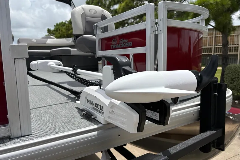 Slide: The Image of Sun Tracker Bass Buggy 18 DLX 2026 with Minn Kota PowerDrive motor on deck. - 4